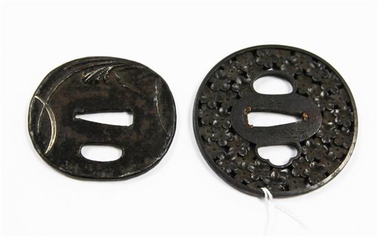 A 19th century Japanese tsuba and another